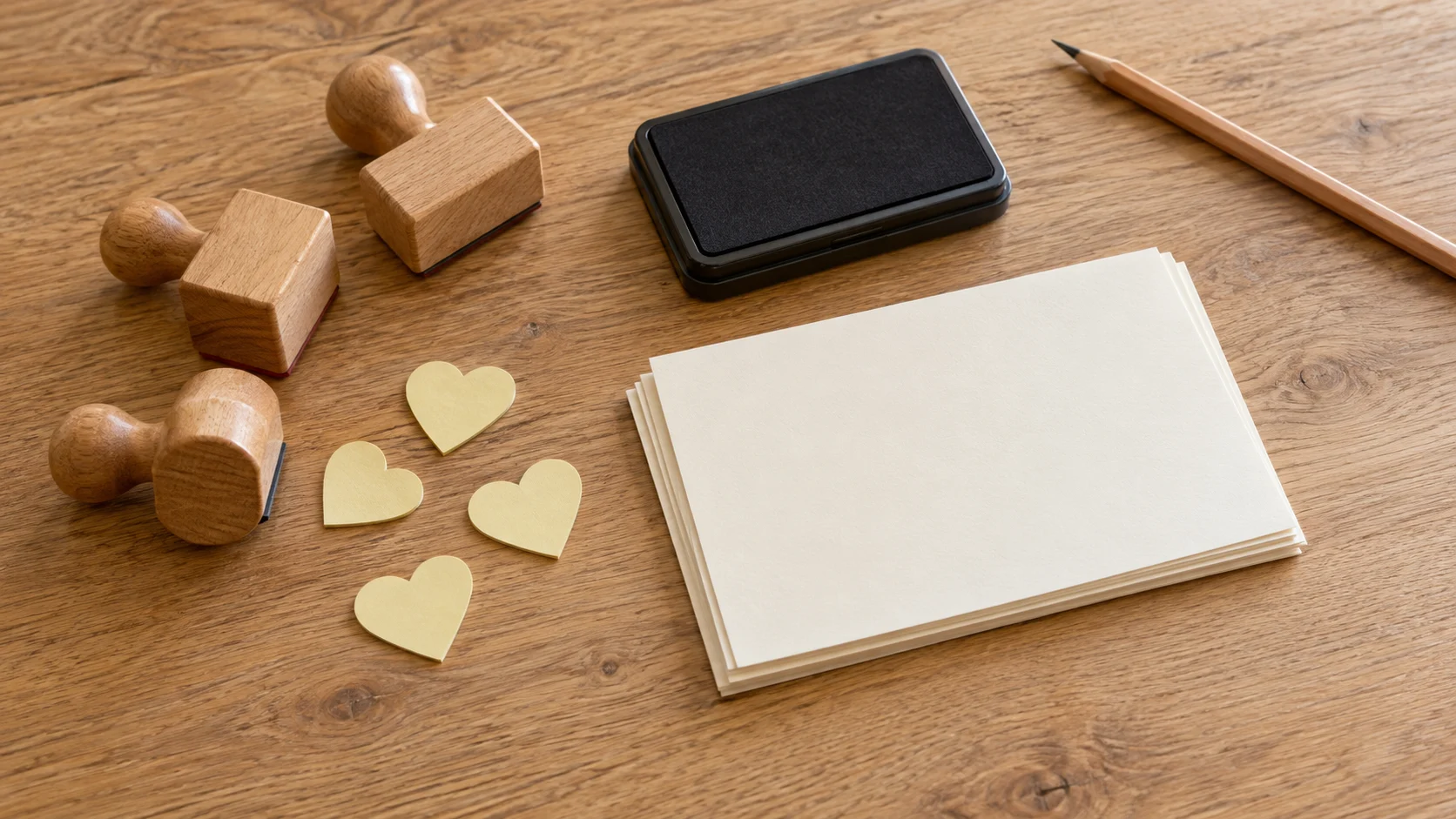 Mask overlapping stamped images represented by generic rubber stamps, plain paper masks and spare card on a craft table.